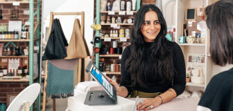 Customer being shown point of sale system