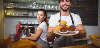 portrait waiter holding plate cup cake counter 1