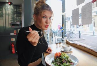 Woman eating salad