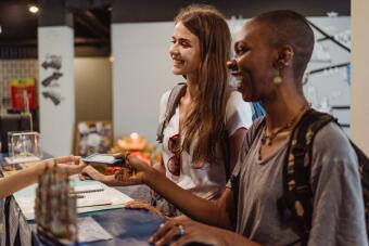 Customers at a hotel reception desk