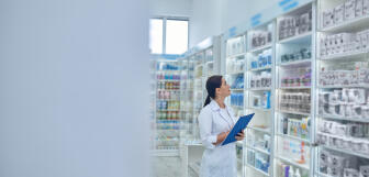 pharmacist checking medicines drugstore