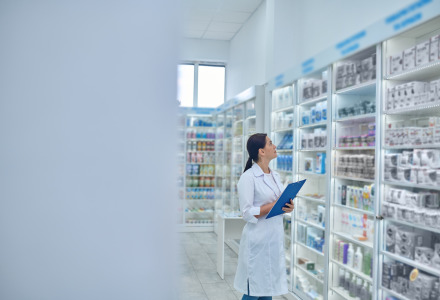 pharmacist checking medicines drugstore