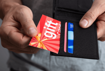 Person getting gift card from wallet